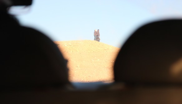 In a recent past several Bedouins, children and adults, have faced problems with settlers and Israeli military that drive by their villages. In the photo a group of exposed school children are waiting eagerly for the transport to arrive. Photo by Rami Kolehmainen/HIRN.     
